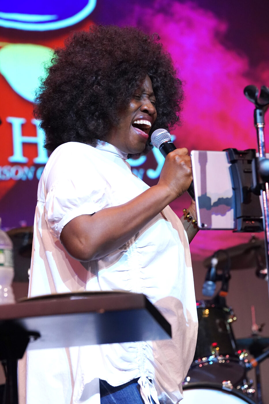 Cyriese Lambert singing on stage